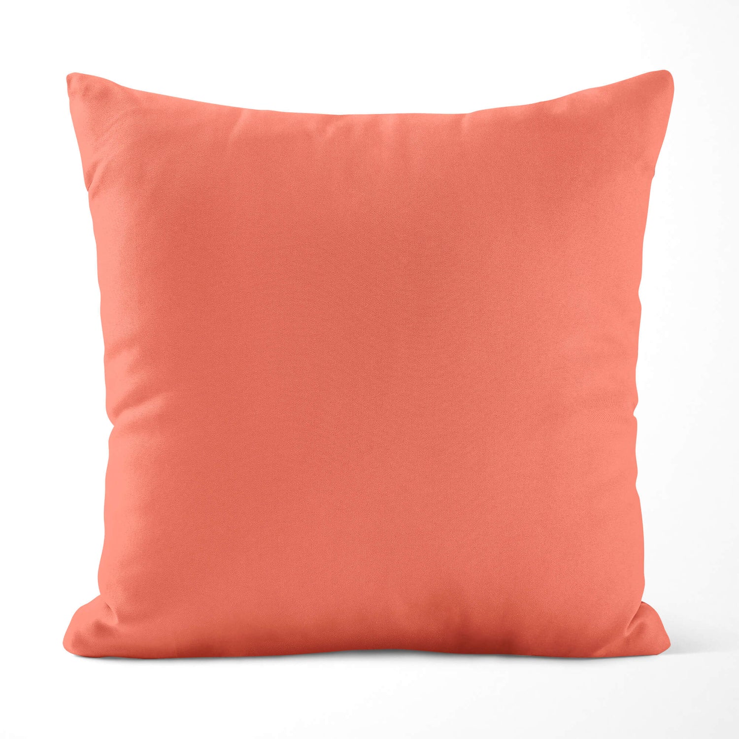 Coral-colored pillow on a white background