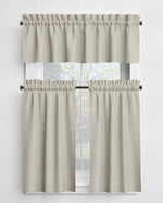Beige window curtain set with a white background