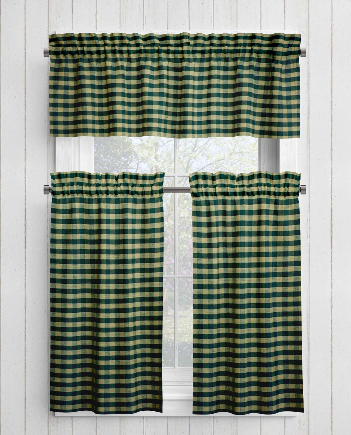 Green and tan checkered curtains on a white window frame