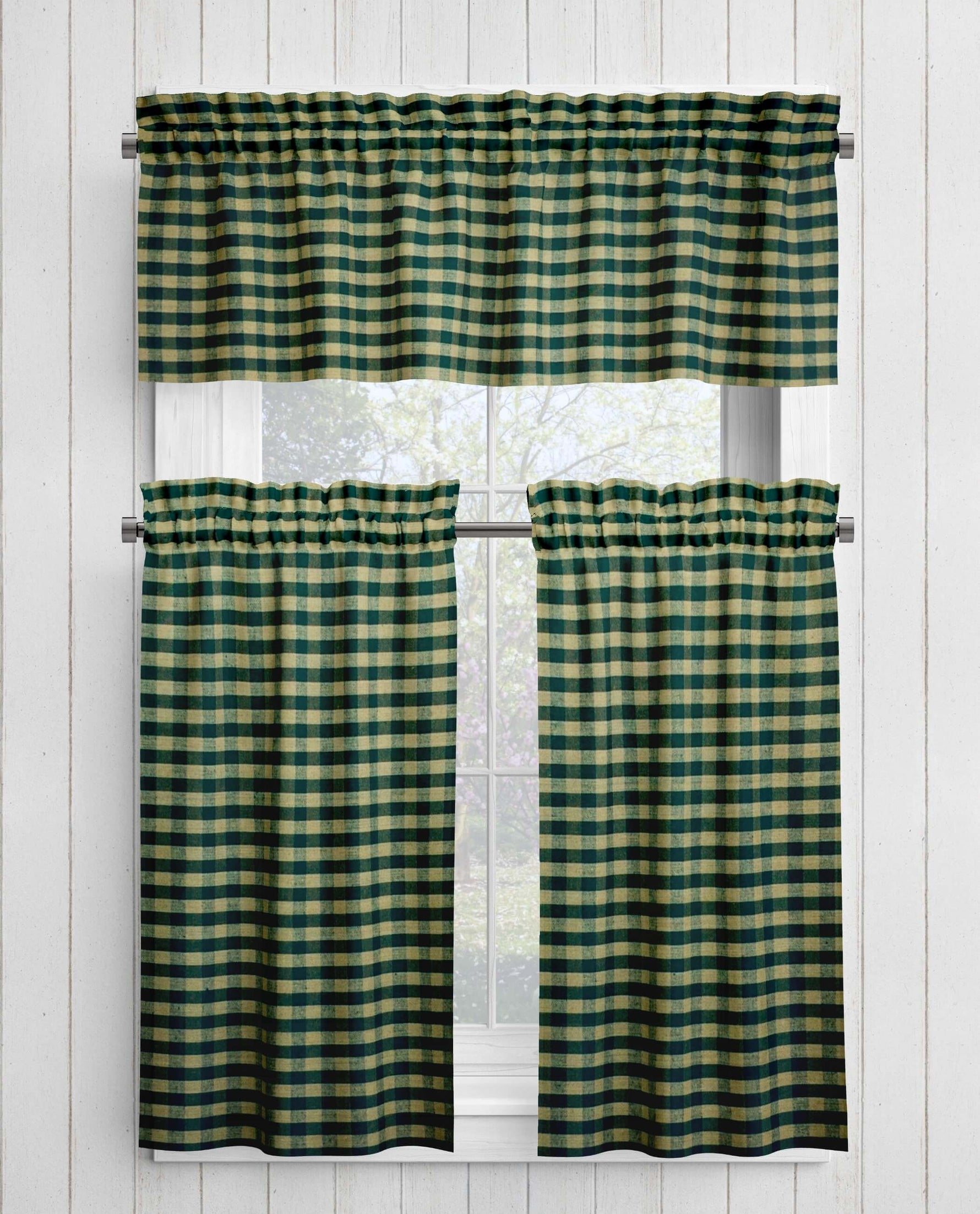 Green and tan checkered curtains on a white window frame