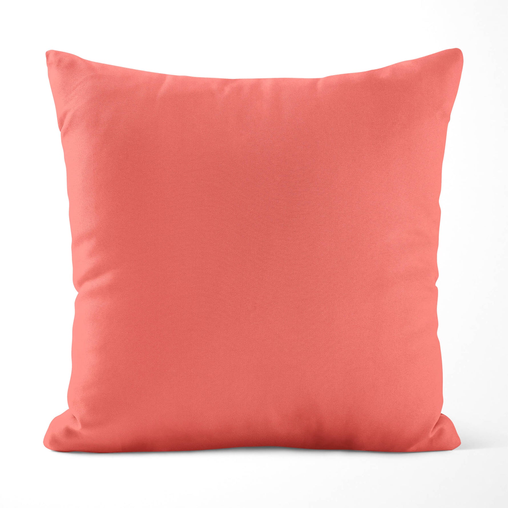 Salmon-colored pillow on a white background