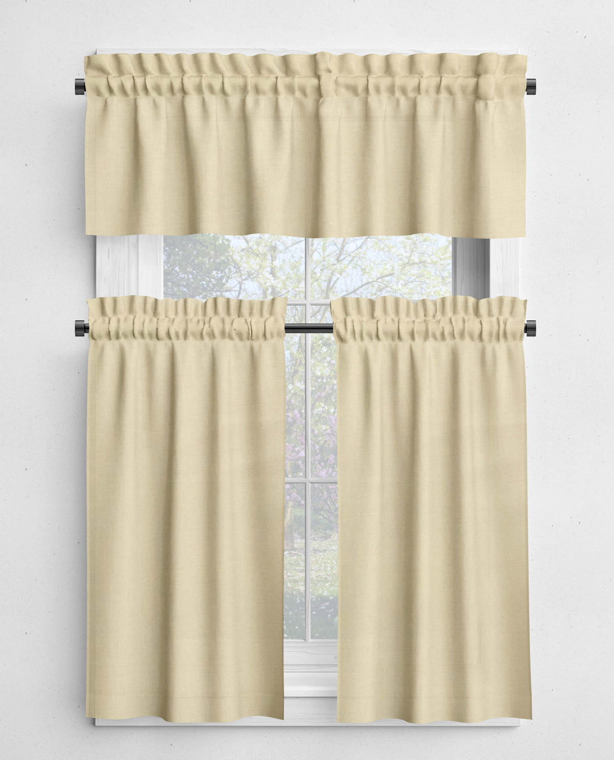 Beige curtains with a valance on a window against a white background