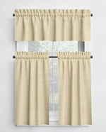 Beige curtains with a valance on a window against a white background