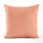 Peach-colored pillow on a white background