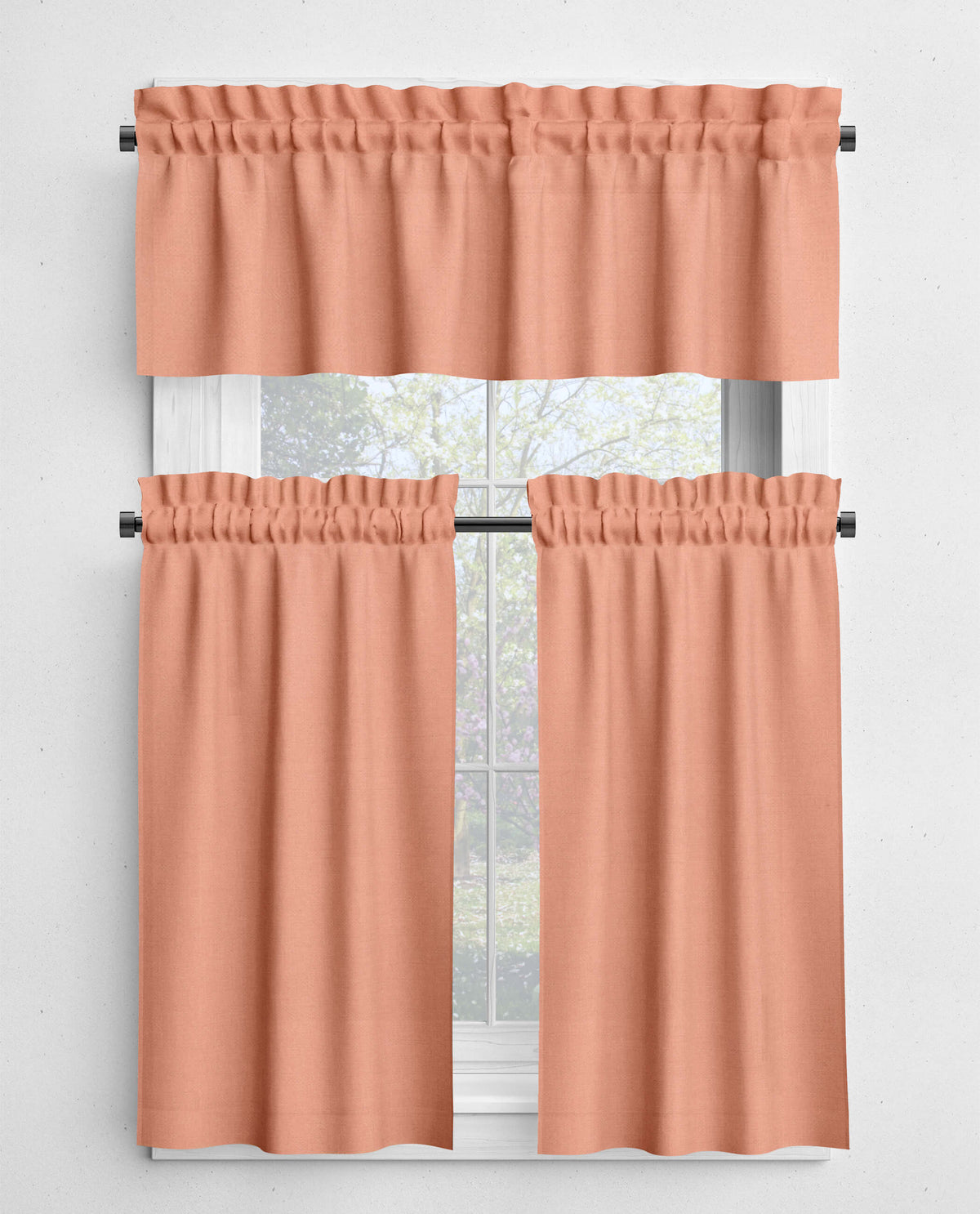Set of peach-colored curtains with a window in the background