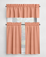 Set of peach-colored curtains with a window in the background