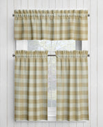 Checkered curtains on a window with a white wooden background