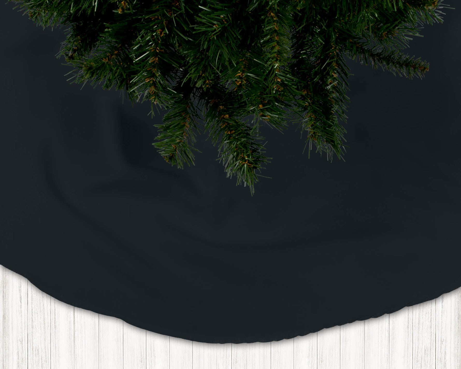 Black Christmas tree skirt with a pine tree on a dark background