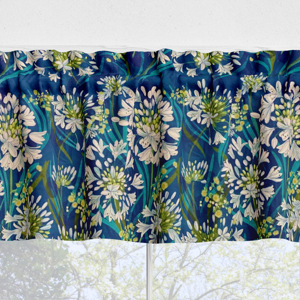 Floral patterned fabric with blue, green, and white colors on a white background