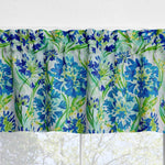 Floral patterned valance with blue and green flowers on a white background