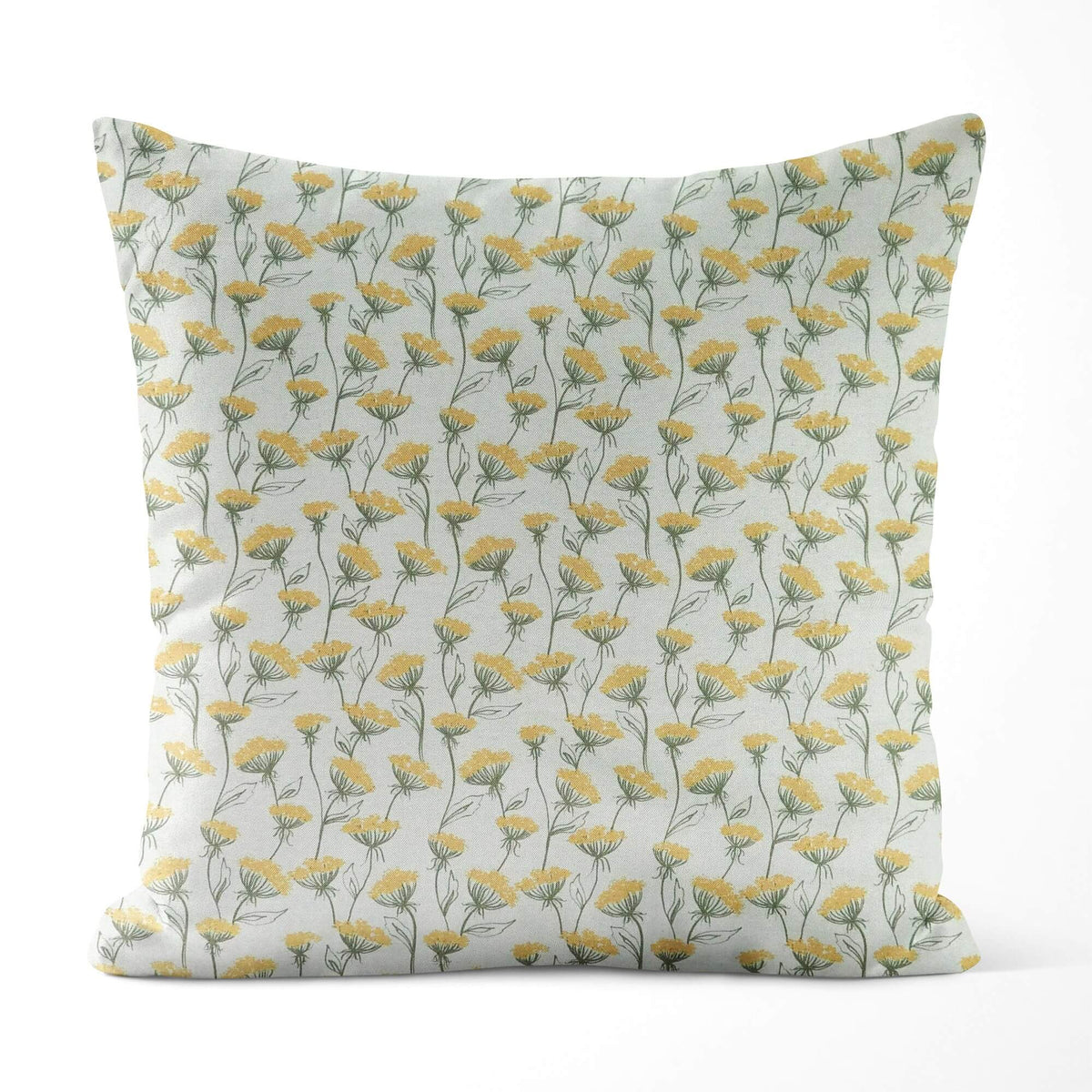 Decorative pillow with yellow floral pattern on a light background