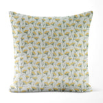 Decorative pillow with yellow floral pattern on a light background