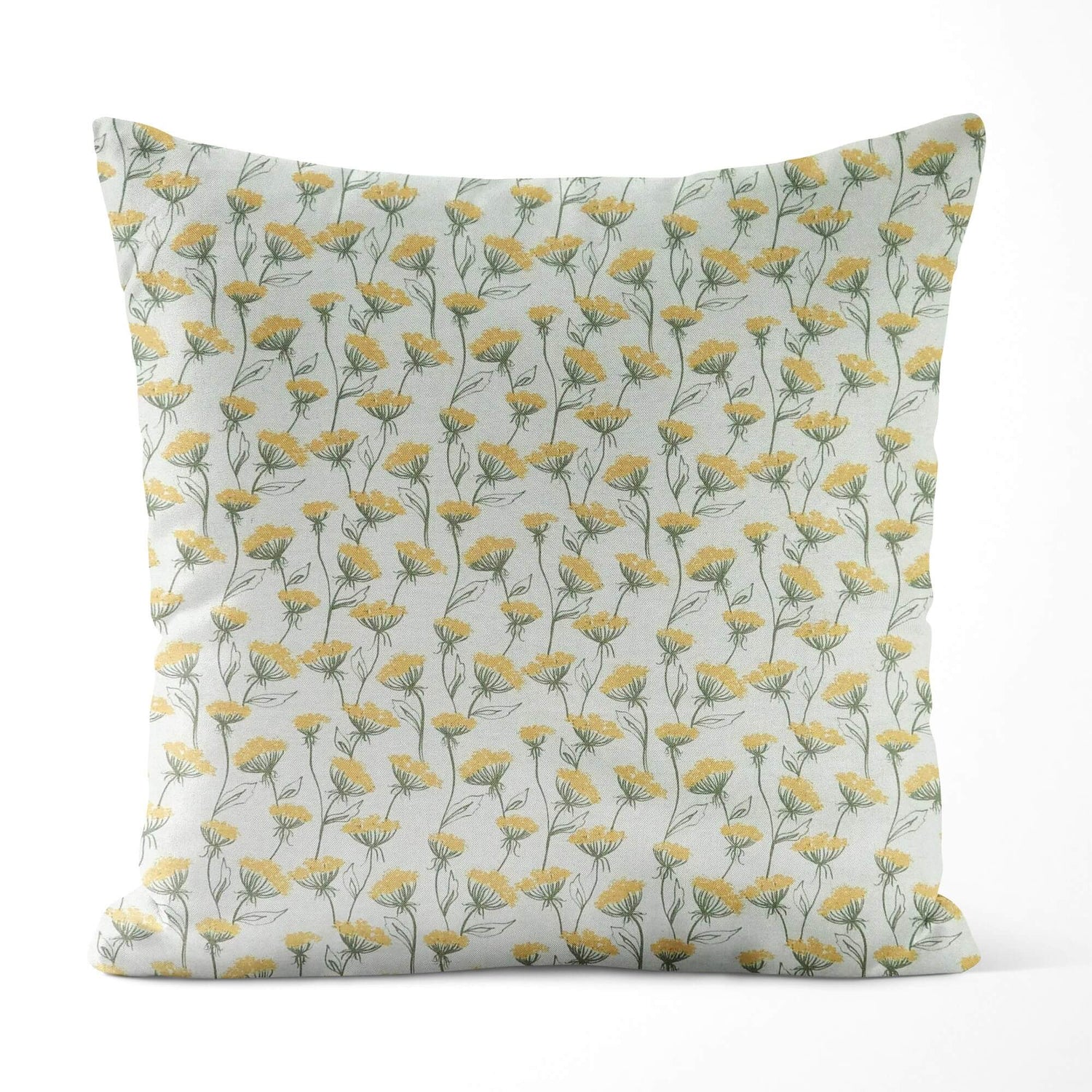 Decorative pillow with yellow floral pattern on a light background