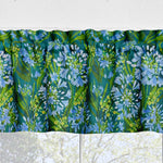 Floral patterned fabric with blue and green flowers on a white background