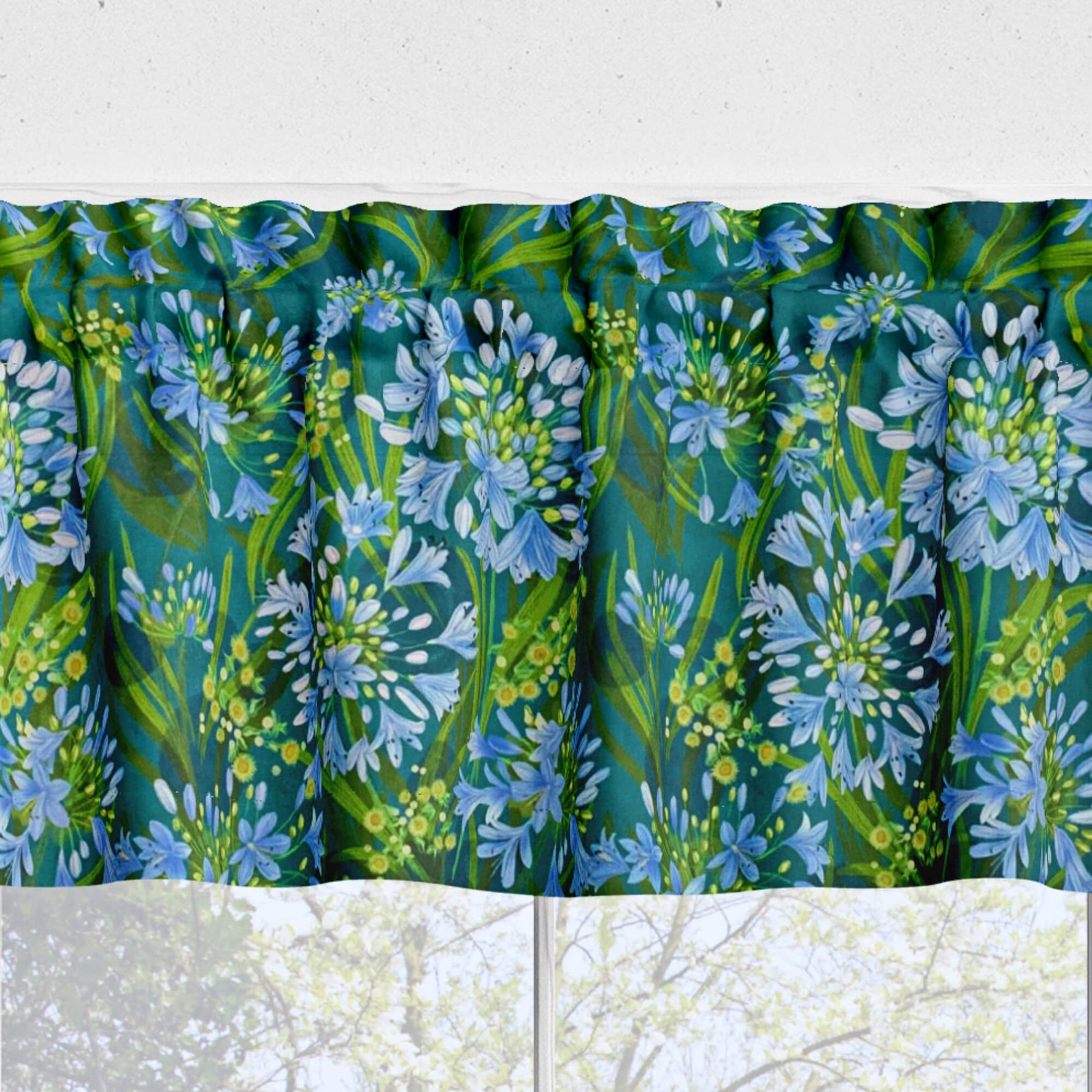 Floral patterned fabric with blue and green flowers on a white background